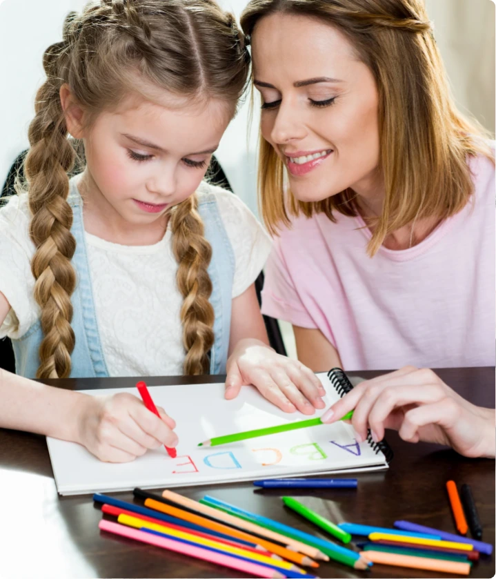 Mother and child coloring together